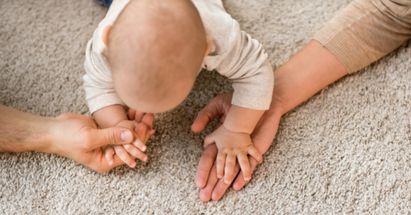 Close up of Family with Baby on Carpet