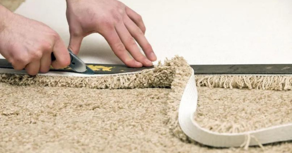 adjust the carpet under the skirting board