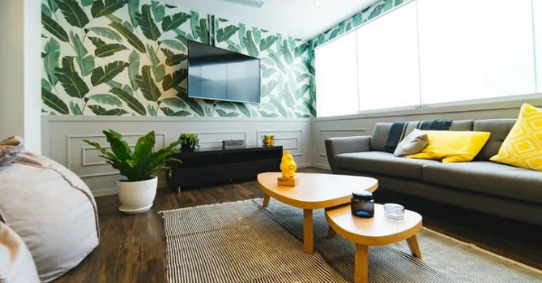 living room with gray sofa and yellow pillows