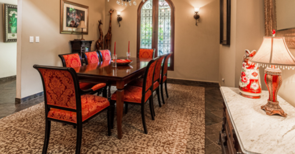 A beautiful dining room with a carpet.